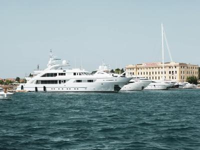 Elegant yachts anchored at Zadar Marina, Croatia, under clear skies.