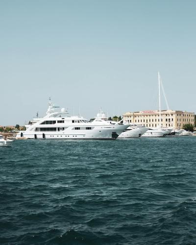 Elegant yachts anchored at Zadar Marina, Croatia, under clear skies.