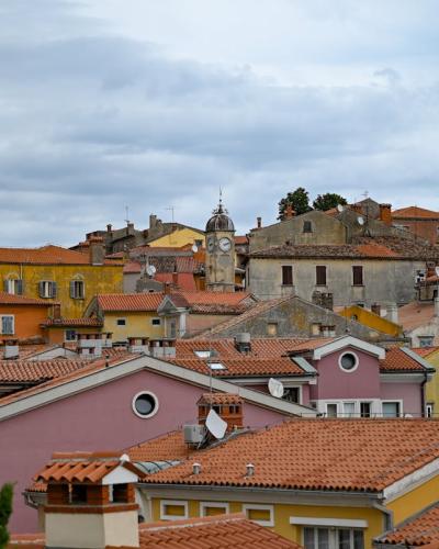 Charming view of Labin's colorful historical buildings and iconic church tower.