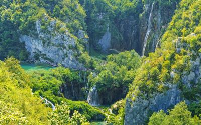 Stunning aerial view of lush waterfalls in Plitvice Lakes National Park, Croatia.