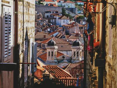 Picturesque view of Dubrovnik's historic red-tiled rooftops and narrow streets.