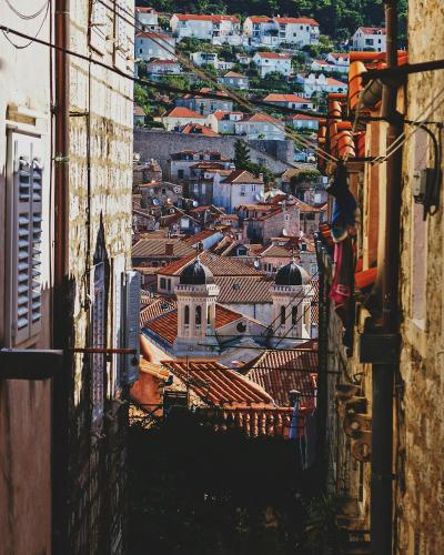 Picturesque view of Dubrovnik's historic red-tiled rooftops and narrow streets.