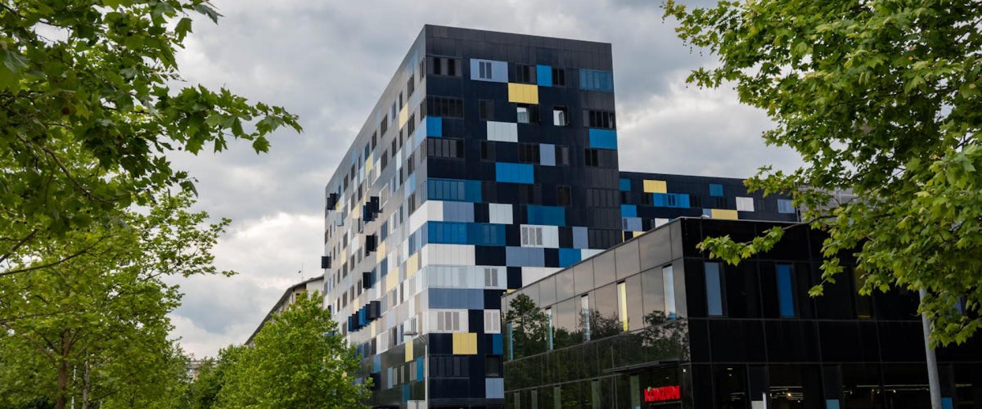 Contemporary apartment buildings along a street in Zagreb, Croatia, showcasing modern urban design.