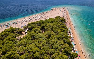 Free Stunning aerial view of the famous Zlatni Rat Beach with turquoise waters, ideal for summer vacations. Stock Photo