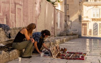 Artisans displaying handcrafted goods in historic Split, Croatia.