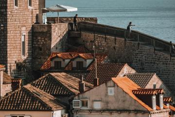 Explore the historic charm of Dubrovnik's architecture with coastal views and old town ambiance.