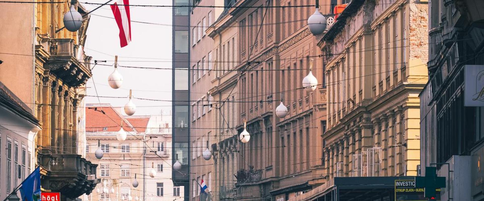 A lively street scene in downtown Zagreb, Croatia, capturing the city's vibrant atmosphere and architecture.
