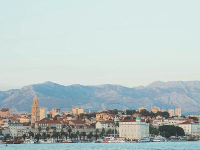 Scenic view of Split's historic architecture with mountains in the background and Adriatic Sea.