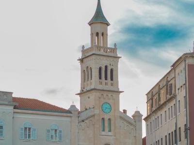 Beautiful view of a historic church in Split, Croatia with cloudy sky backdrop.