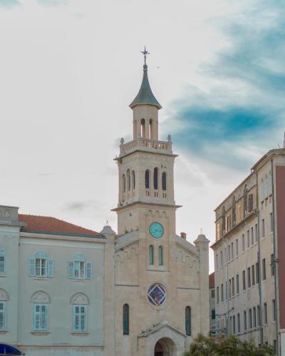 Beautiful view of a historic church in Split, Croatia with cloudy sky backdrop.