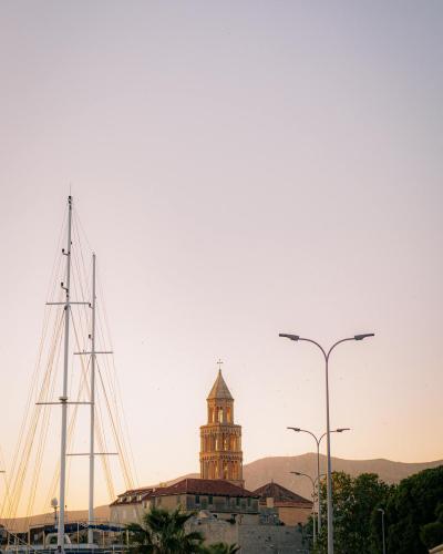 View of Diocletian's Palace in Split, Croatia at sunset with clear sky and cityscape.