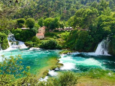 Picturesque view of waterfalls and lush greenery in Krka National Park, Croatia.