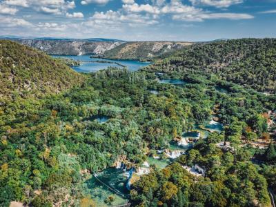 A breathtaking aerial view of lush greenery and waterfalls in Krka National Park, Croatia.