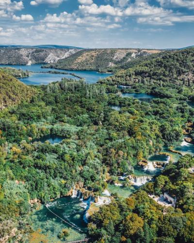 A breathtaking aerial view of lush greenery and waterfalls in Krka National Park, Croatia.