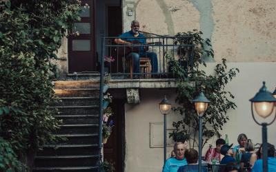 Charming outdoor dining in Croatia with live music and night ambiance.