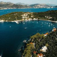 A stunning aerial shot of Koločep Island, Croatia, showcasing the azure waters and lush landscape.