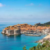 A breathtaking aerial view capturing the coastal charm of Dubrovnik's ancient architecture by the Adriatic Sea.