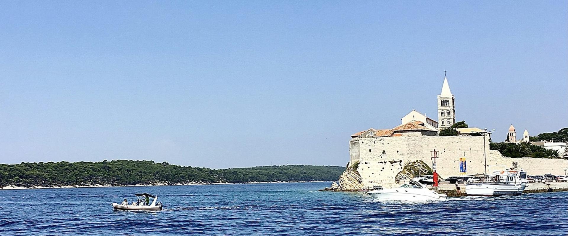 a small boat in a large body of water