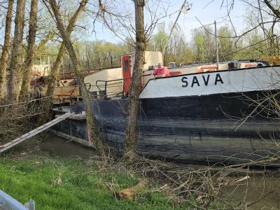 River ship "Sava" parked on banks of river Lonja