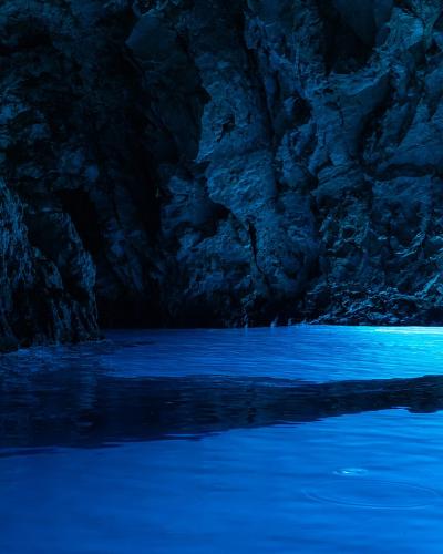 Sunlight turning the water blue inside the Blue Cave on Biševo