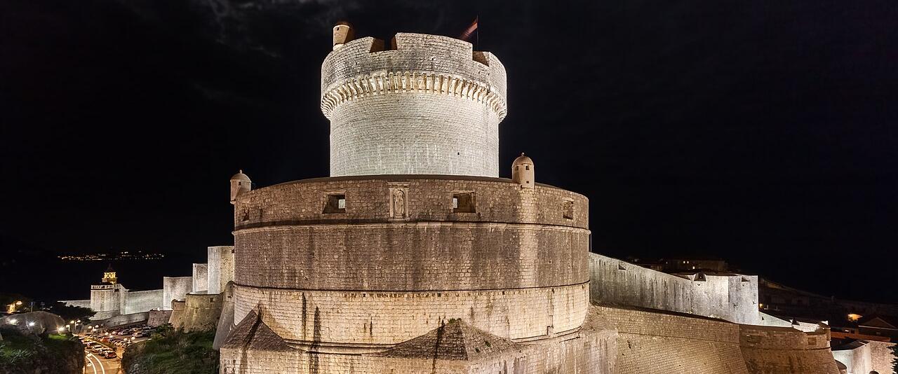 The floodlit Minčeta tower on Dubrovnik's city walls at night
