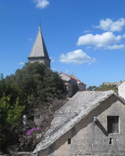 Stone houses and church tower in Škrip, home of the Brač Museum