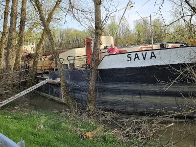 River ship "Sava" parked on banks of river Lonja