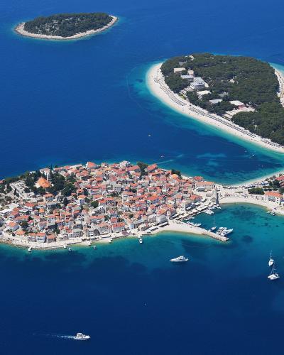 Aerial view of the Primošten old town peninsula and its neighbouring beaches on the Adriatic