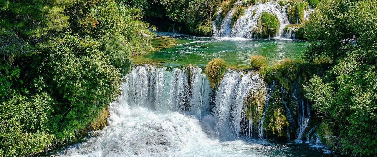 Skradinski buk waterfall cascading into a green pool in Krka National Park