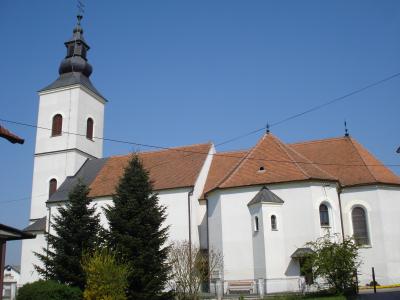 The white Church of the Assumption of the Blessed Virgin Mary with its bell tower in Belica, Međimurje
