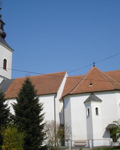 The white Church of the Assumption of the Blessed Virgin Mary with its bell tower in Belica, Međimurje