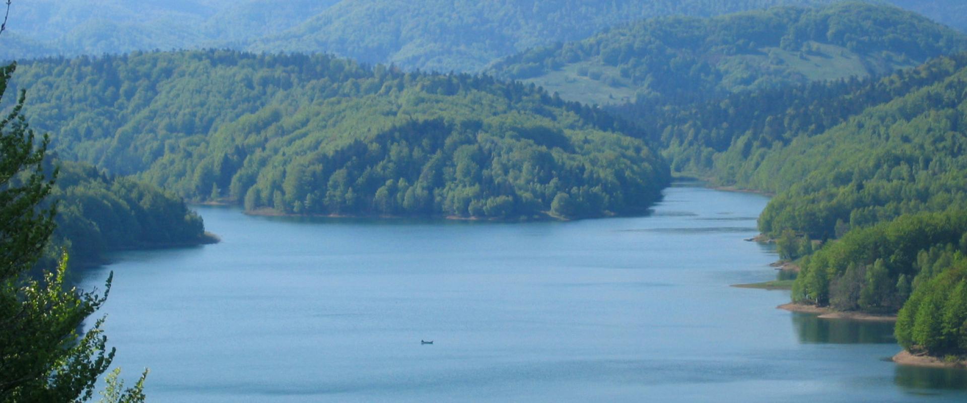 Lokvarsko Lake surrounded by forested mountains in Gorski Kotar