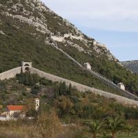 The Walls of Ston climbing the hillside above Ston on the Peljesac peninsula, Croatia